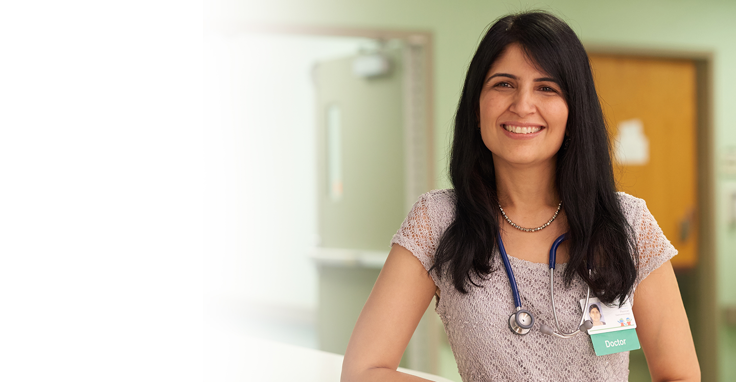 Dr. Nitika Gupta smiling in clinic