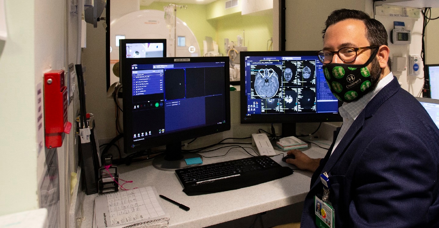 Dr. Goldman-Yassen reviewing MRI scan