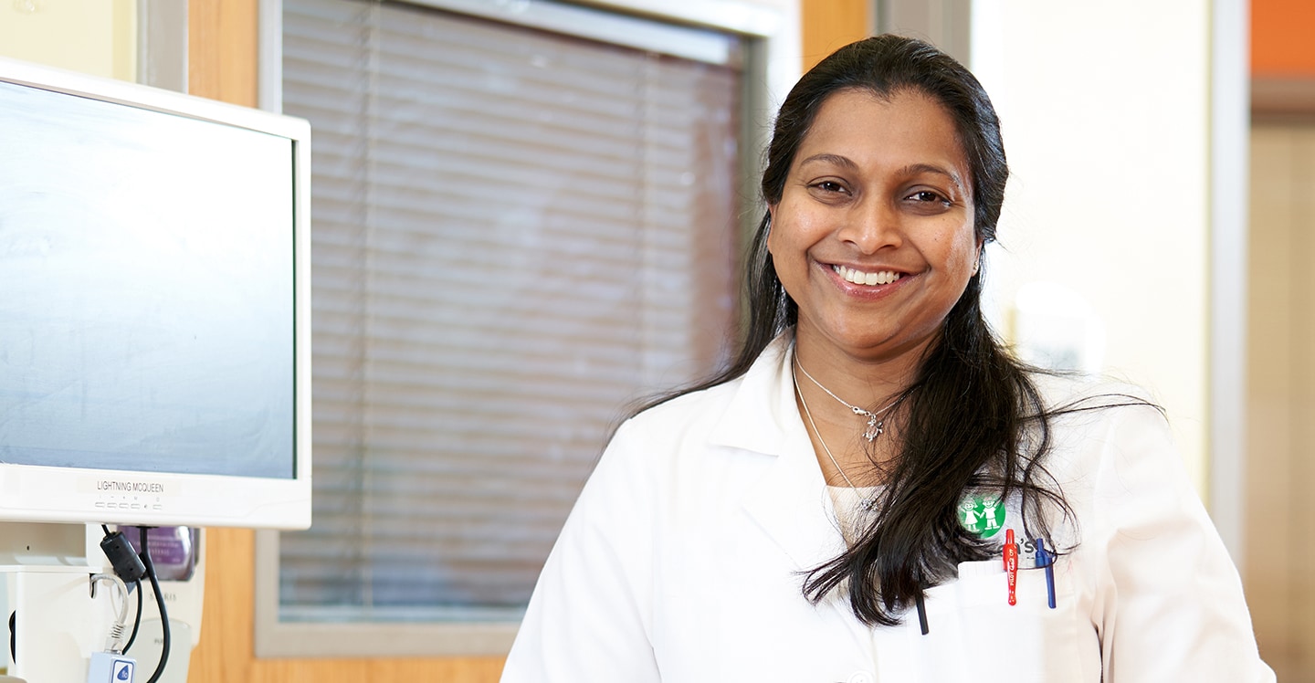 cardiac physician smiling at camera