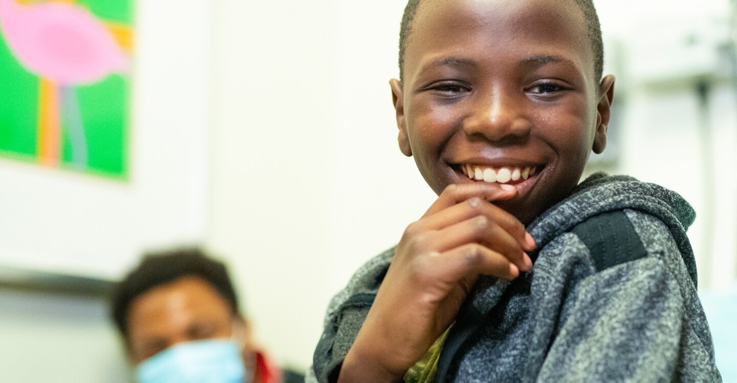 pediatric blood disorders patient smiling in hospital bed