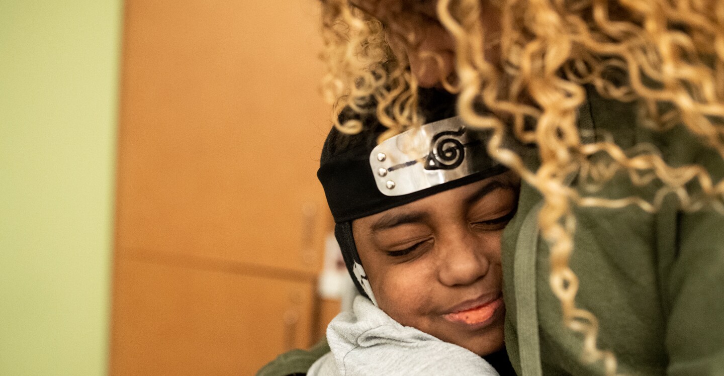 pediatric sickle cell disease patient hugging mom