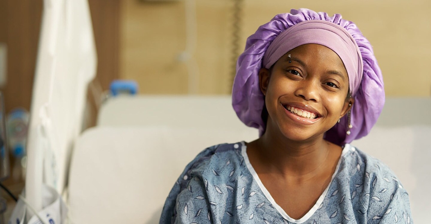 Child smiling in hospital bed