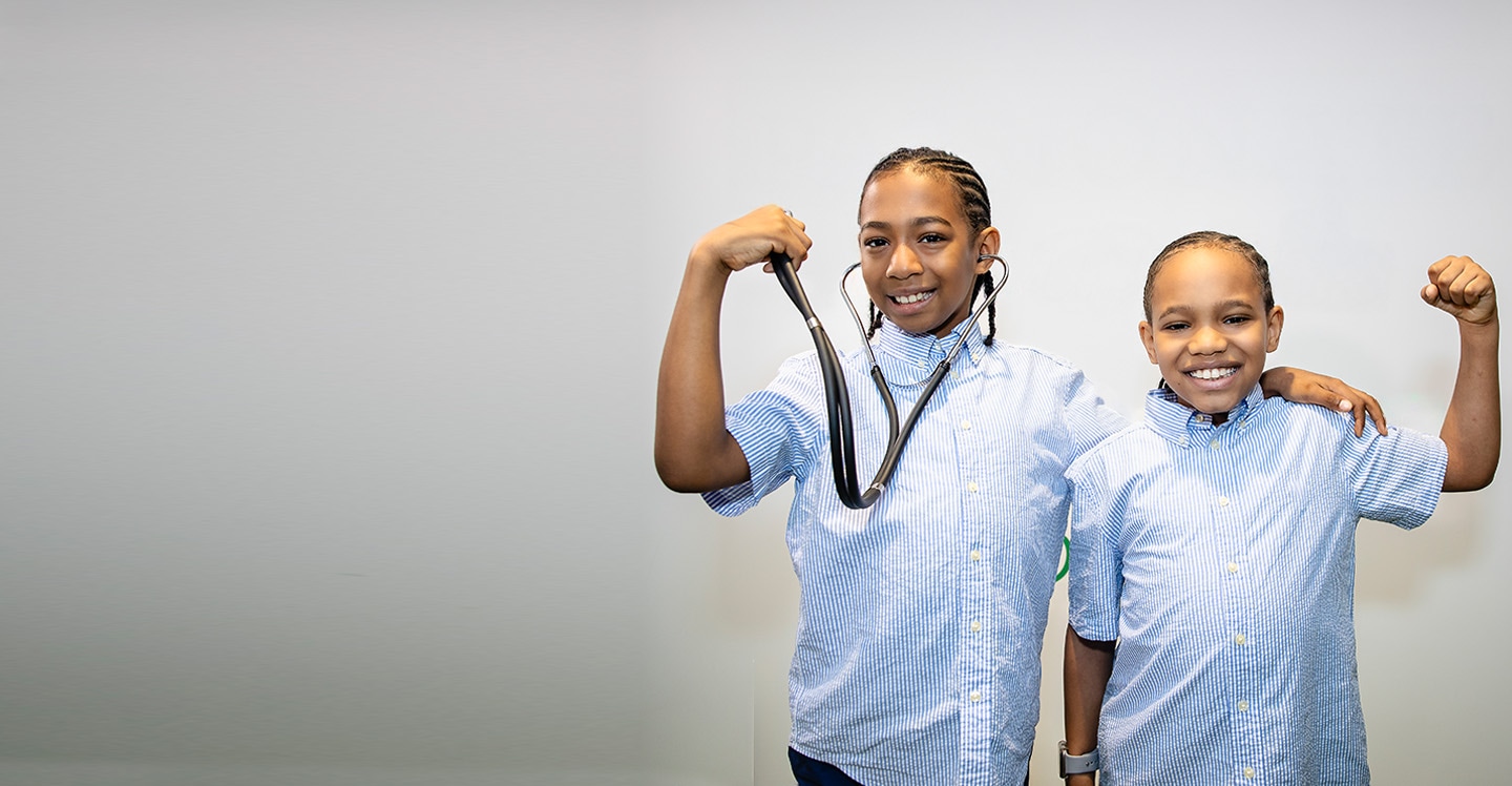 Saxton and Sawyer flex their muscles for childhood cancer awareness month
