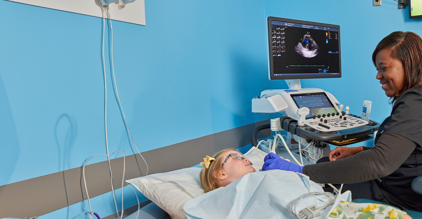 Sonographer performing echocardiogram on heart patient