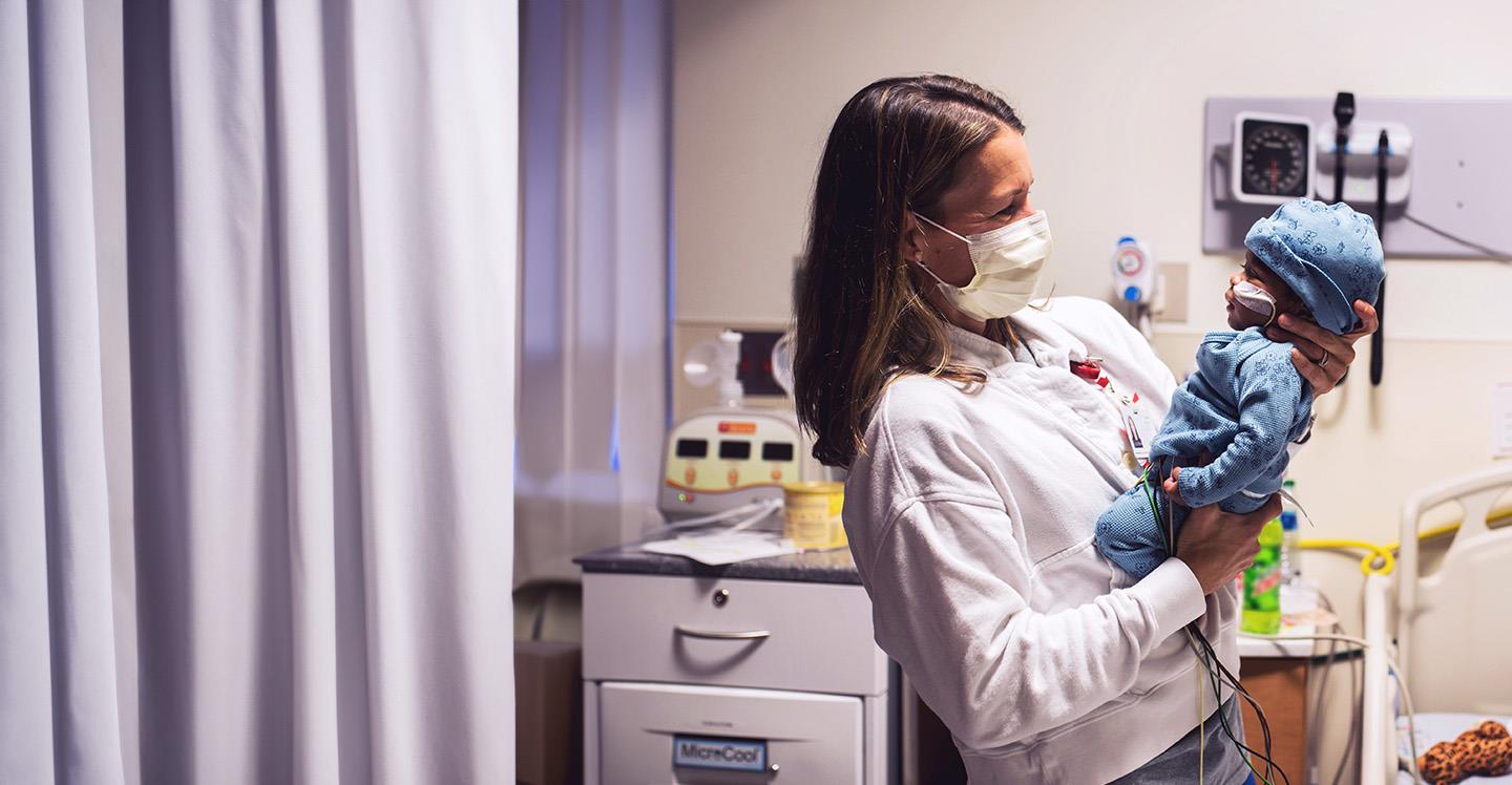 Nurse in Cardiac Acute Care Unit cares for heart patient