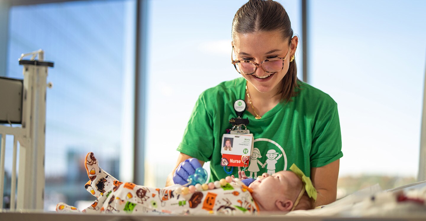 Nurse taking care of infant in cacu