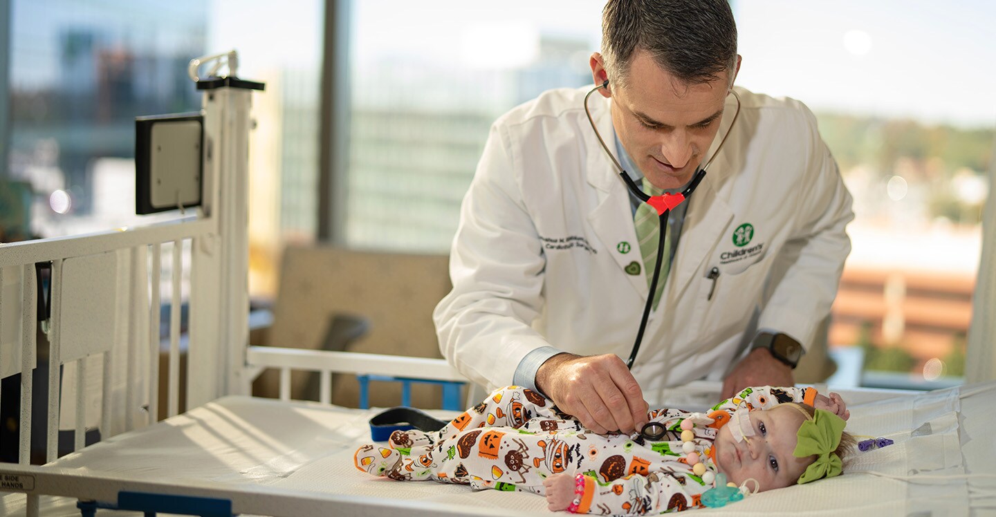 Physician listening to baby's heart