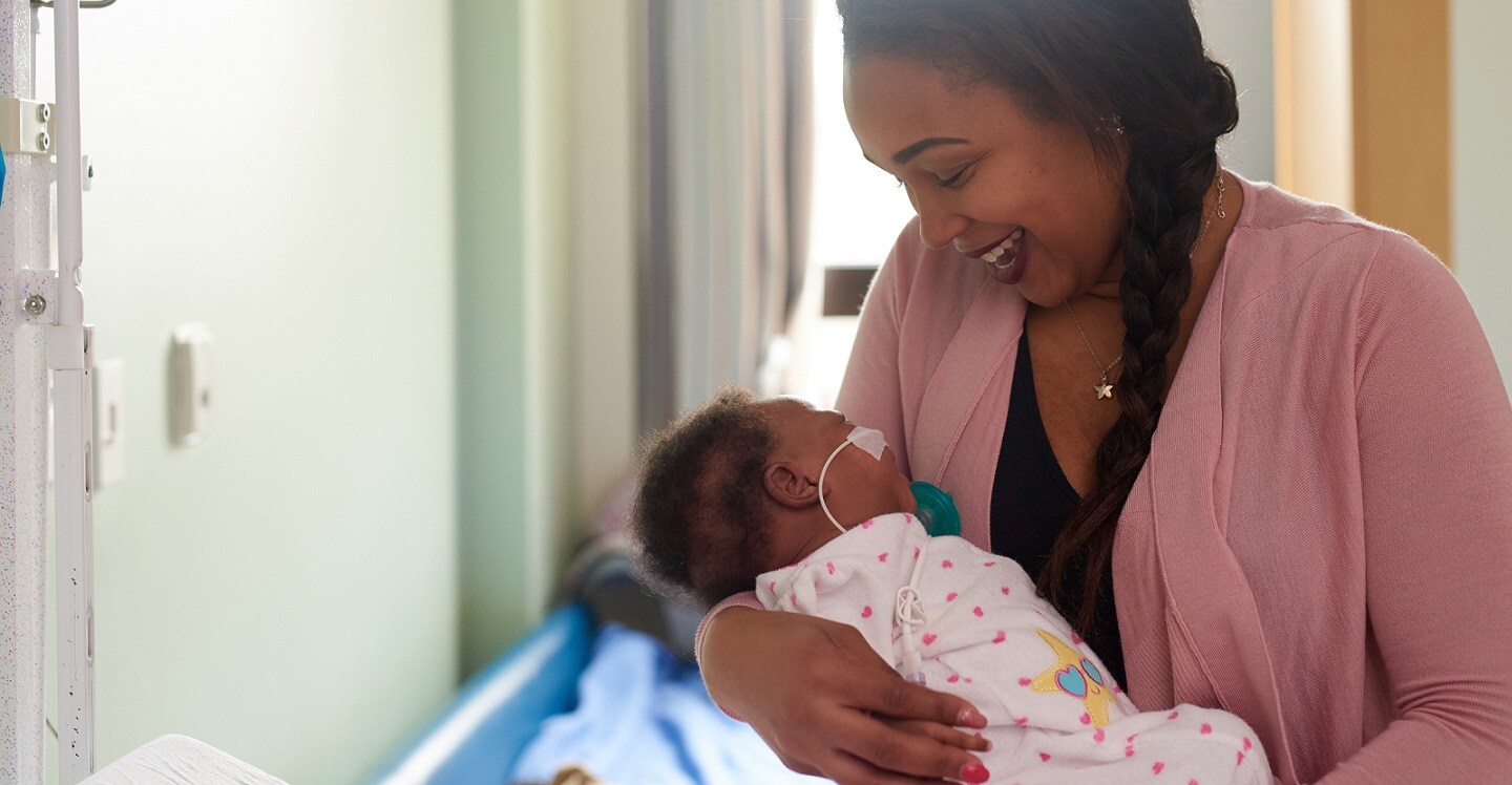 Mom holding infant