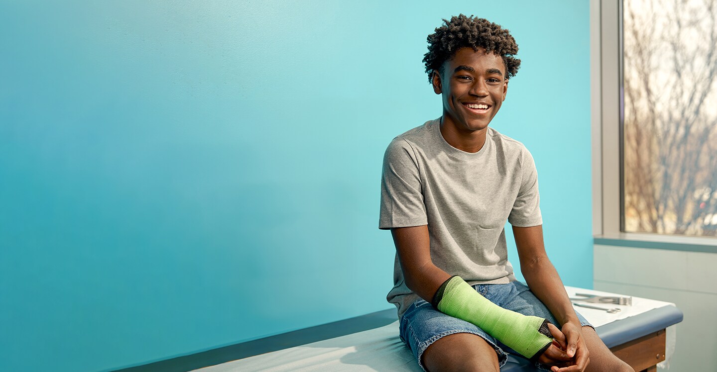 Orthopedics teen patient in arm cast