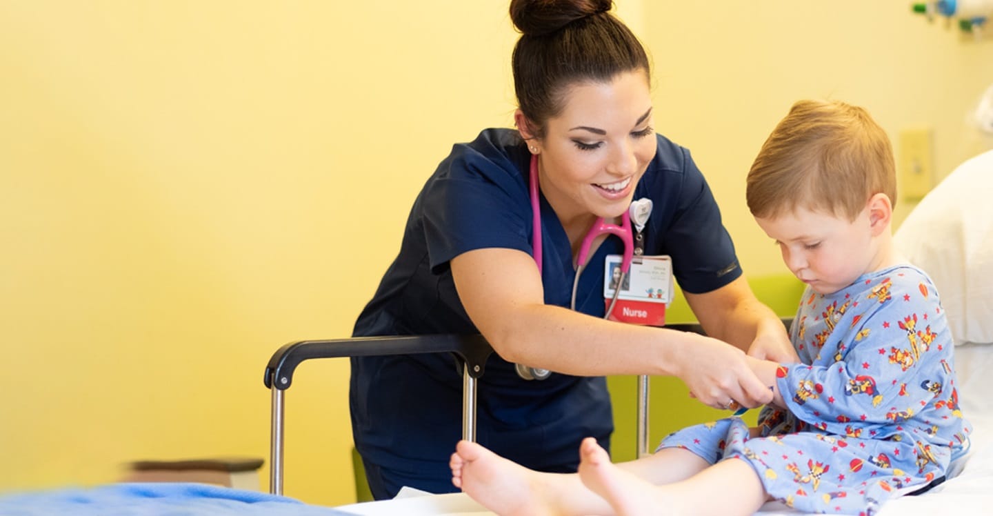 Little boy with nurse getting ready for surgery