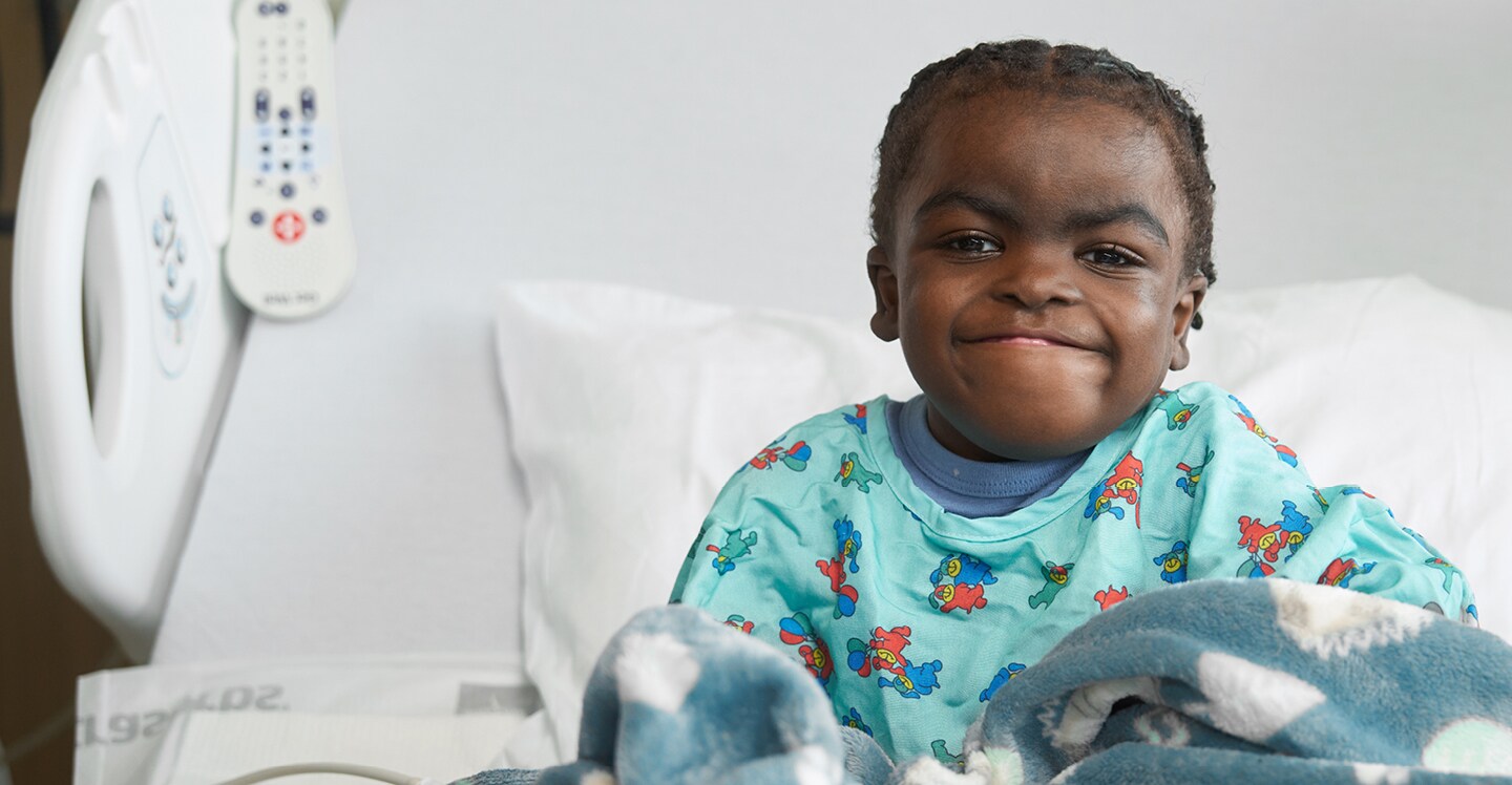 Transplant patient sitting in hospital bed