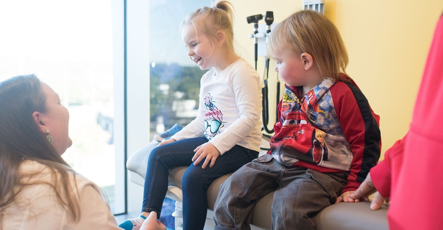 Urologist at Children’s Healthcare of Atlanta examines two young patients