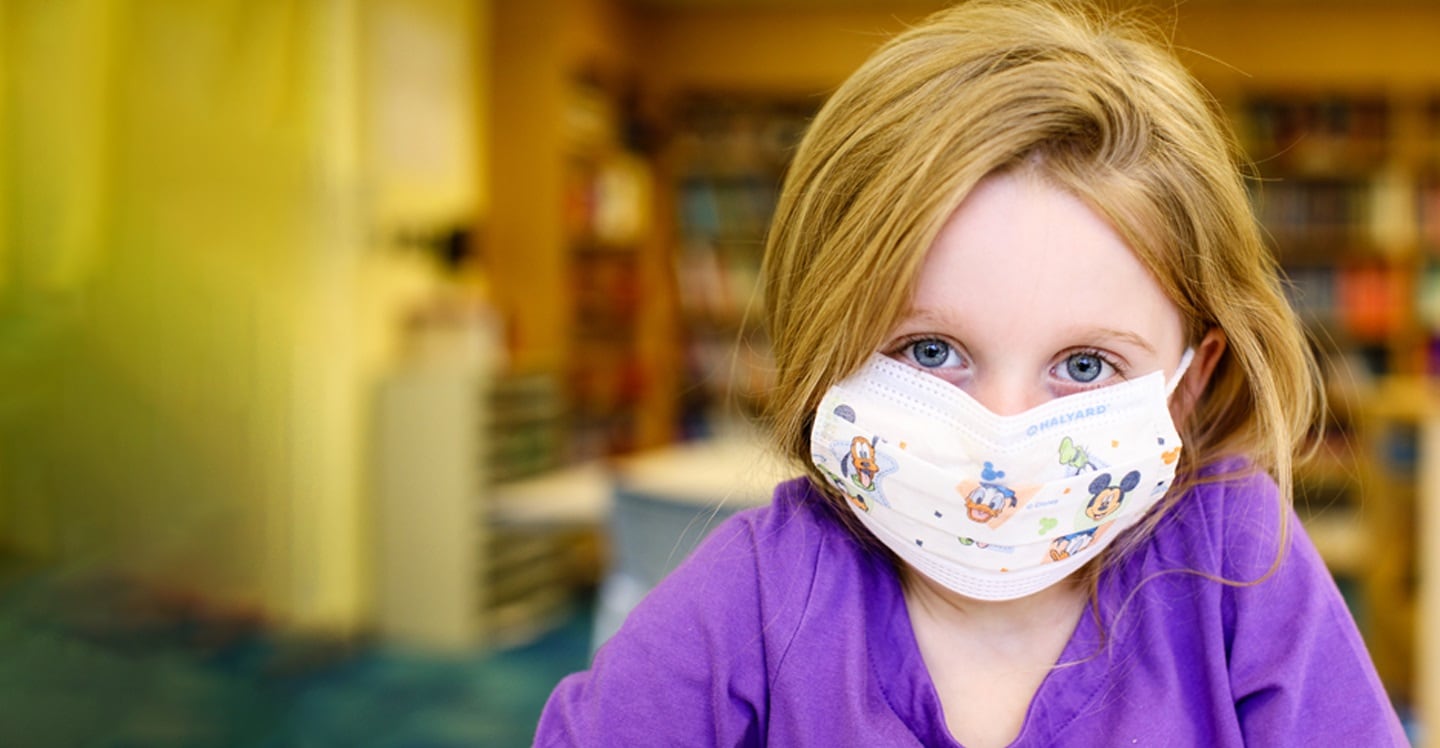 cystic fibrosis patient wearing mask in pediatric hospital