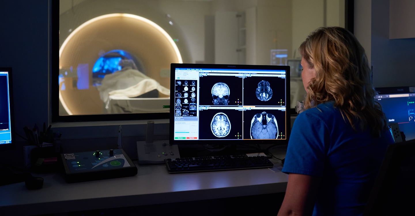 Doctor reading pediatric CT scan