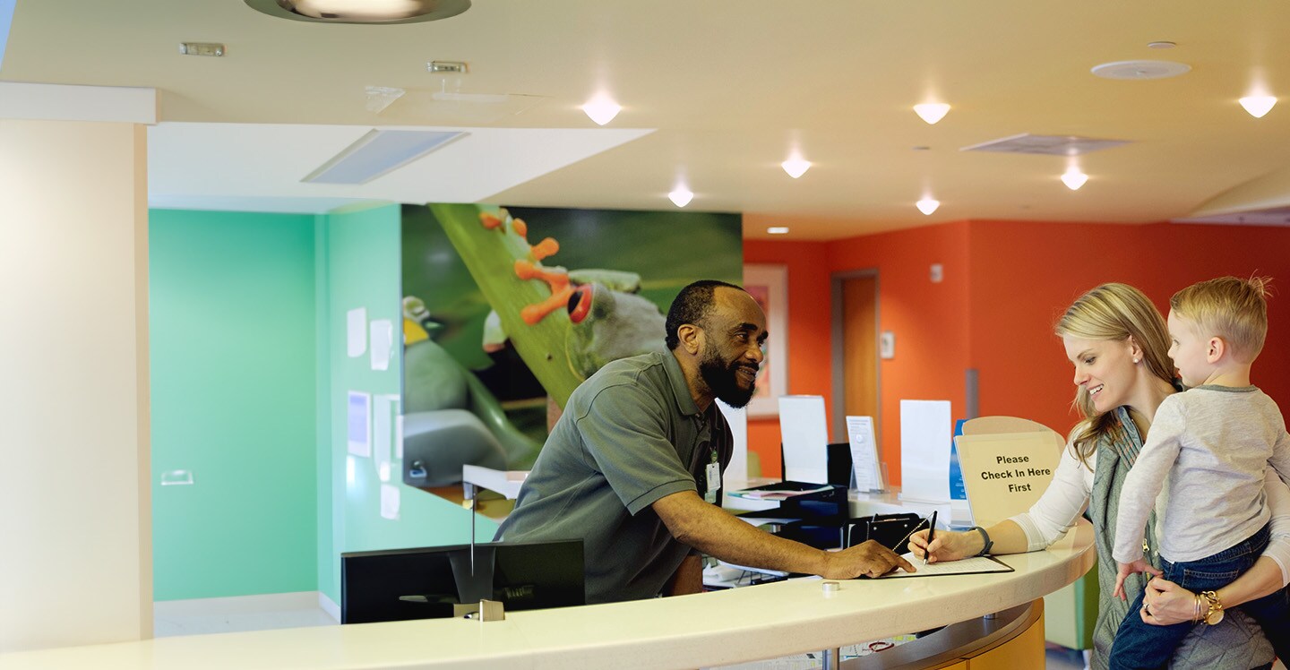 mother and child at Scottish Rite Check In desk