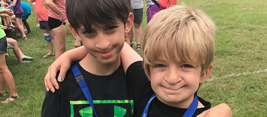 Boys smiling at pediatric summer camp 