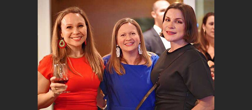 Three women standing together