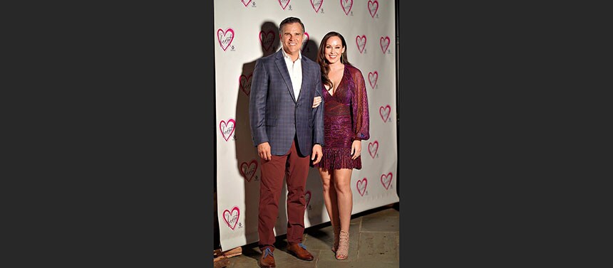 Couple posing at entry