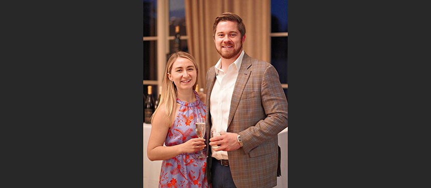 Couple posing with drinks