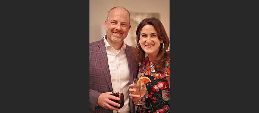 Couple posing with drinks