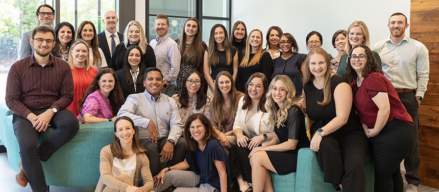 Large group of pediatric pharmacy team smiling