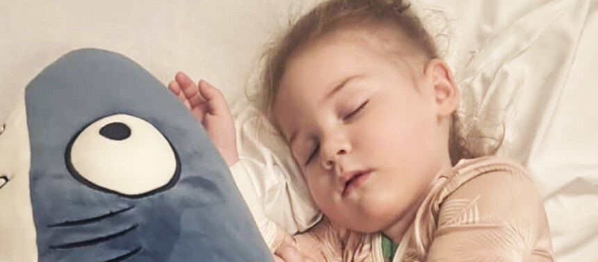 Noah asleep with favorite stuffed animal