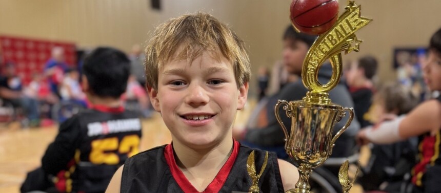 Paul smiling with trophy