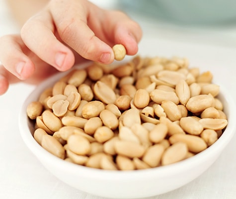 picking peanuts out of a bowl