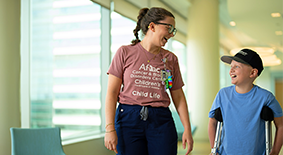Nurse with patient on crutches