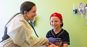 doctor checking patient's heart