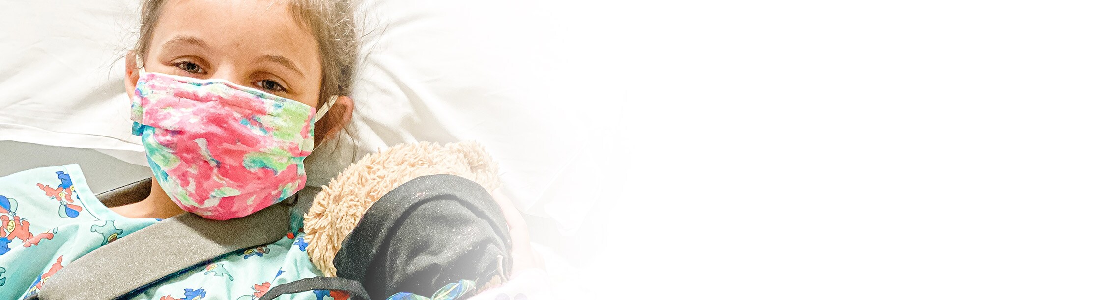 pediatric patient in mask safely getting care