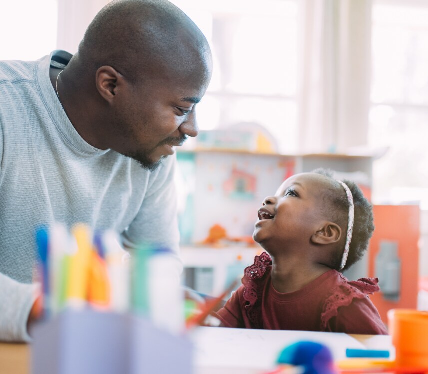 father and daughter playing