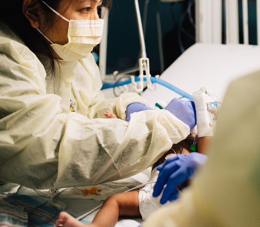 nurses training and caring for nicu baby at pediatric hospital