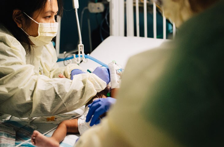 nurses training and caring for nicu baby at pediatric hospital