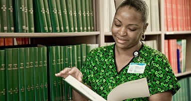 Clinical staff member in library