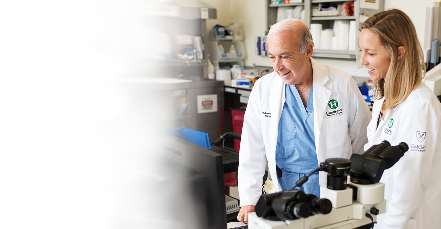 Dr. Reisner and Dr. Blackwell in lab coats